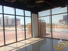 Street-Facing Shop | HE One Building | Road View