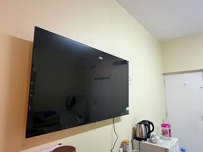 50-55 inch Wall-Mounted LED TV in Good Working Condition