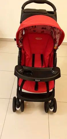 Red Graco Baby Stroller with Snack Tray along with car seat- Good Condition