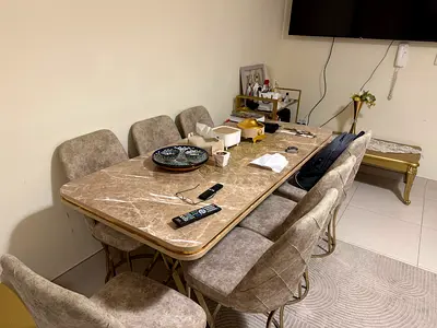 Marble-top dining table with 6 upholstered chairs - good condition