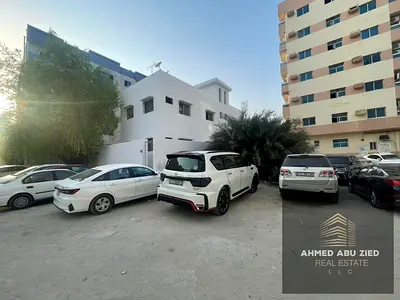 Building for Sale in Al Nakhil, Ajman with AED 100K Annual Income, Near the Corniche, Prime Location, Second Plot from the Main Road, AED 950K.