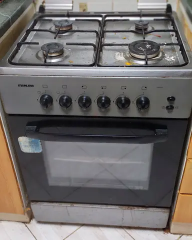 Used Nikai 4-Burner Gas Stove with Oven - Working Condition