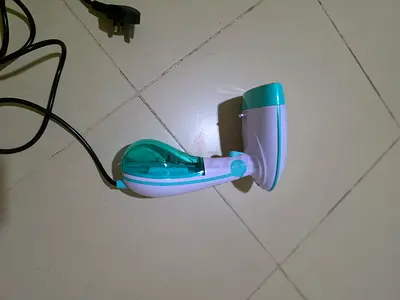 Handheld garment steamer - compact travel clothes steamer