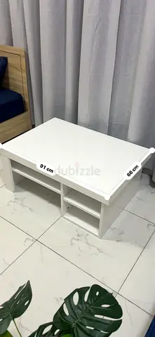 White wooden coffee table with storage shelves - 91x66 cm