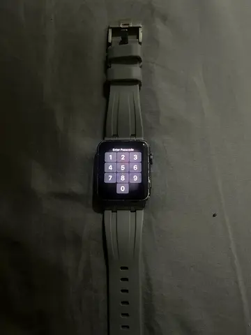 Used square-screen smartwatch with silicone band - good condition