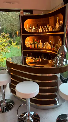 Curved Home Bar Unit with Illuminated Shelving and Glass Top