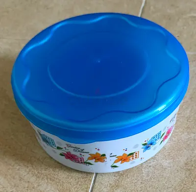 Round Plastic Storage Container with Floral Design, Blue Lid