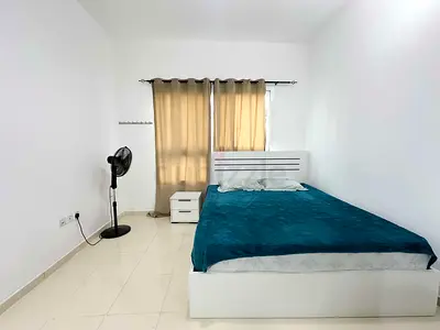 White Bed Frame with Mattress, Side Table and Standing Fan
