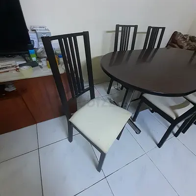 Dining table with 6 wooden chairs - dark finish, good condition