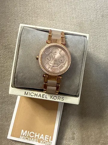 Michael Kors rose gold women's watch with crystal bezel
