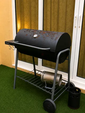 Used charcoal BBQ grill with thermometer and side shelf