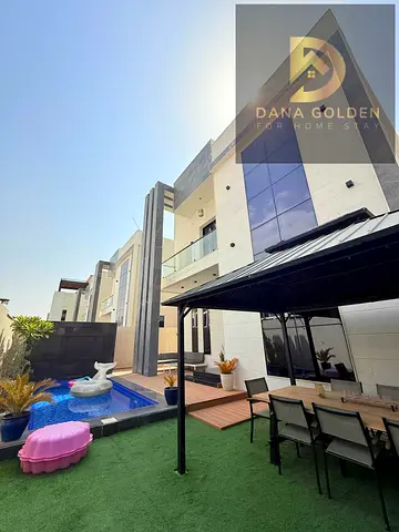 For rent in Al Bahya, Ajman: a villa featuring 4 master bedrooms, a majlis, a living area, a spacious kitchen, and a swimming pool.