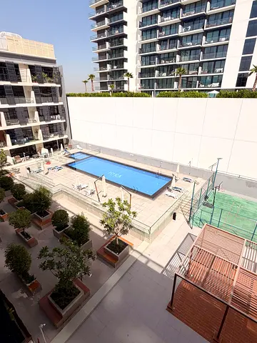 Elegant 1BR Apartment | Excellent Location | Balcony & Pool View
