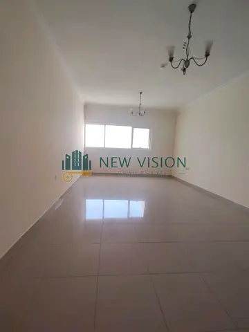 Two Bedrooms + Living Room with an Open View, Free Parking, Balcony, Very Spacious Layout, Prime and Convenient Location Near the Dubai Exit.