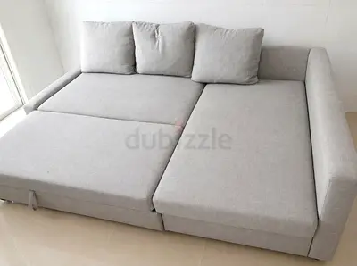 Light grey L-shaped sofa bed with chaise, converts to bed - good condition