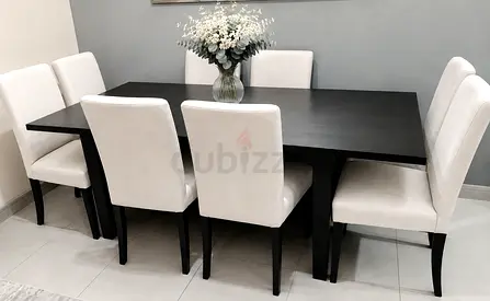 IKEA Extendable dining table with 8 chairs.