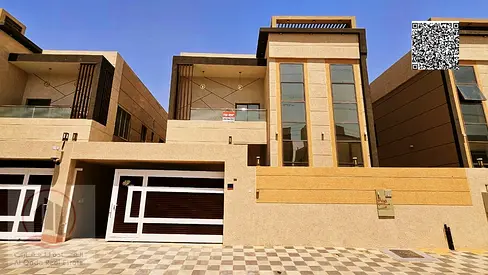 Villa for sale in Ajman, Al Yasmin area, including electricity, water, and air conditioning. 5 master bedrooms, living room, majlis, and maid's room.