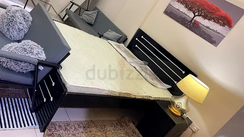 Queen bed frame with mattress and bedside table - good condition