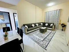 Two furnished bedrooms and a living room for monthly rent in Ajman Corniche, all bills included.
