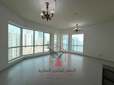 Sea view with the largest spacious 1-bedroom apartment, landlord-covered central AC, and one month free in one of the finest towers in Sharjah