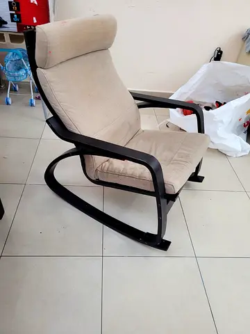 Beige Padded Rocking Armchair with Black Frame - Good Condition