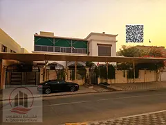 Villa for sale in Ajman, Al Zahiyah area, including water and electricity, 6025 sq ft, 5 master bedr