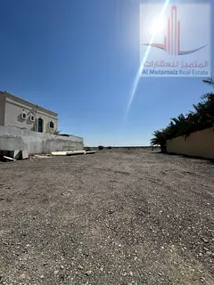 For Sale in Al Manama 4 – Corner Plot on Two Streets, 4,305 sq ft, for only AED 175,000!