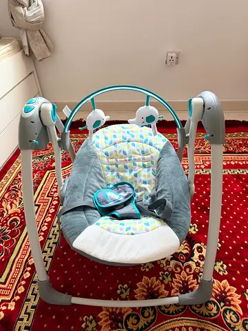 Baby electric swing/rocker with toys - gently used