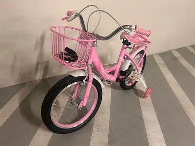 Pink girls' kids bicycle with front basket - good condition