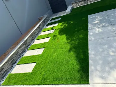 Well-installed Artificial Grass Lawn with Stepping Stones - Like New