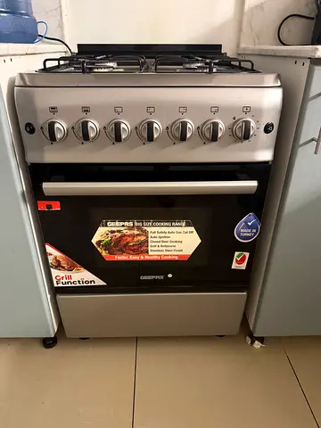 Good condition stainless steel gas cooker with oven - 4 burners