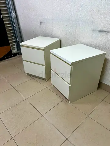 Pair of white bedside nightstands with two drawers