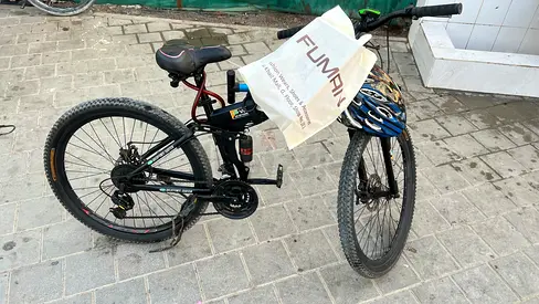Used mountain bike with front suspension and helmet included