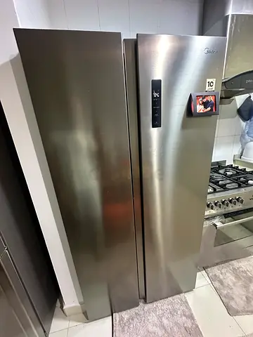 Large stainless steel side-by-side refrigerator - good condition