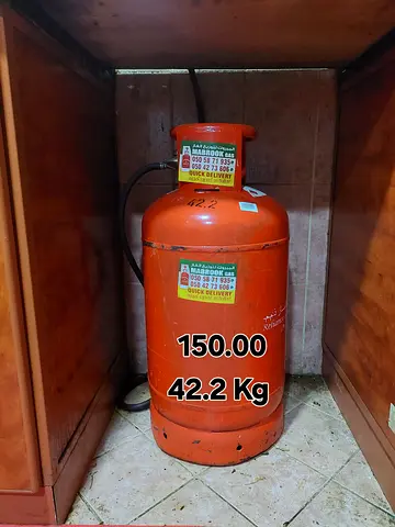 A big 42.2Kg gas cylinder with half gas, pipe and regulator for urgent sale.