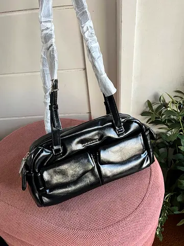 Black faux leather shoulder bag with front pockets