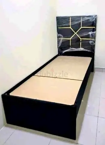 Single bed frame with padded headboard — good condition