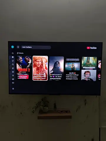 55-inch Smart LED TV mounted on wall - Good working condition