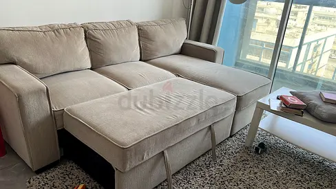 Light beige L-shaped fabric sofa with chaise, good condition