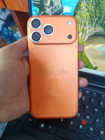 Used iPhone (orange case) with triple camera - Good working condition
