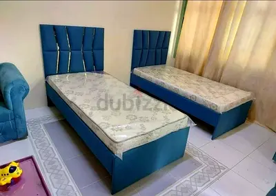 New Pair of Single Beds with Mattresses - Blue Upholstered Headboards