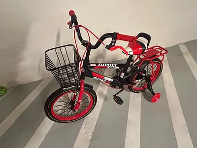 Kids red and black 12-inch bicycle with training wheels and basket