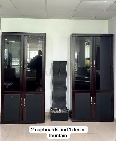 2 large wooden display/storage cabinets with glass doors + 1 decorative indoor water fountain.