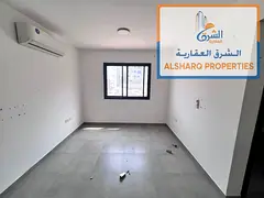 Studio apartment with a semi-detached kitchen, spacious layout, split AC, and easy access to Dubai a