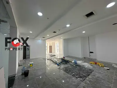 A very large office or corporate headquarters—an entire floor spanning 5,000 square feet—located in the Ajman Clock Tower. Priced at AED 220,000