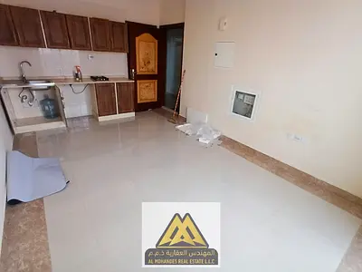 Studio for annual rent in Ajman, with central air conditioning and a balcony with a beautiful view,