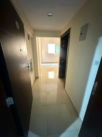 One-bedroom apartment with a living room and parking in Al Qasba – direct from the owner.