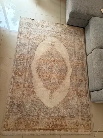 Light beige vintage-style area rug