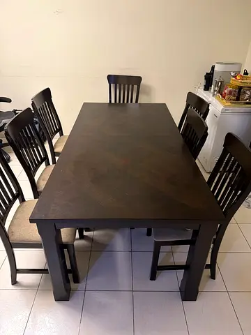 Solid wood dining table with 9 chairs - dark finish for sale. excellent condition price negotiable