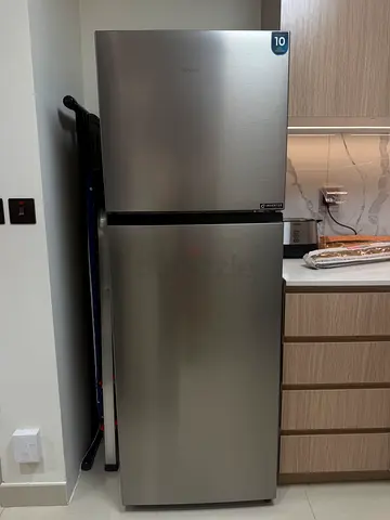 Silver two-door refrigerator in good condition